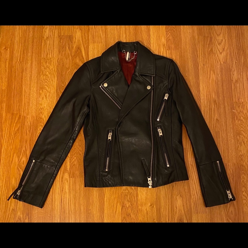 Black leather biker jacket with red lining